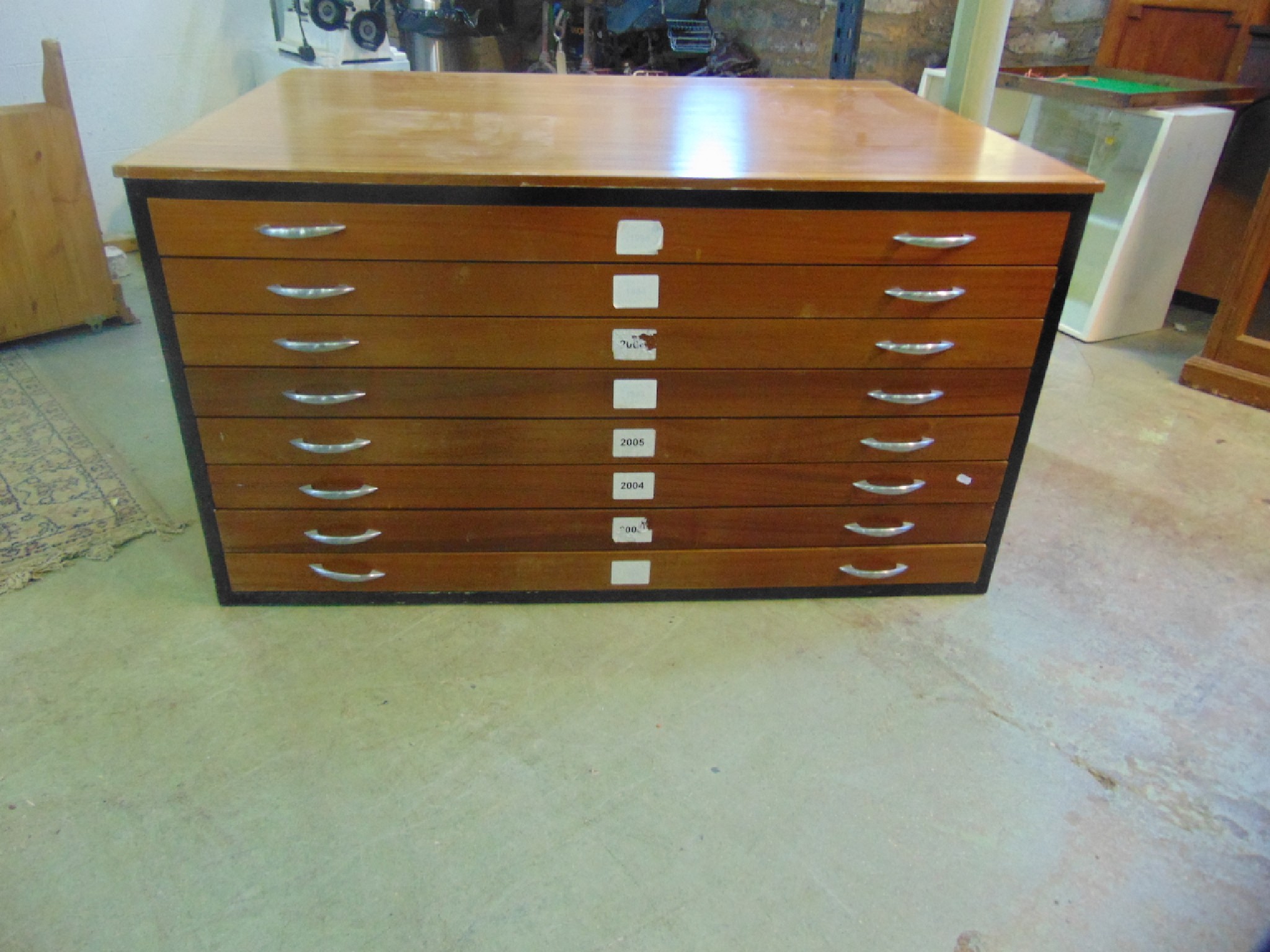 Appraisal: A mid to late th century teak plan chest fitted