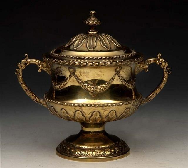 Appraisal: AN EDWARDIAN SILVER GILT SUGAR BASIN AND COVER with urn