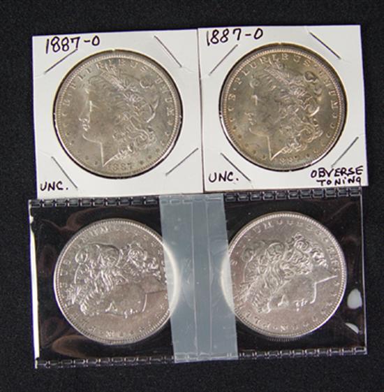 Appraisal: Two Uncirculated -O Morgan Dollars Plus two - Tail Feathers