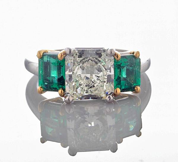 Appraisal: A diamond and emerald ring centering a square-cut diamond weighing