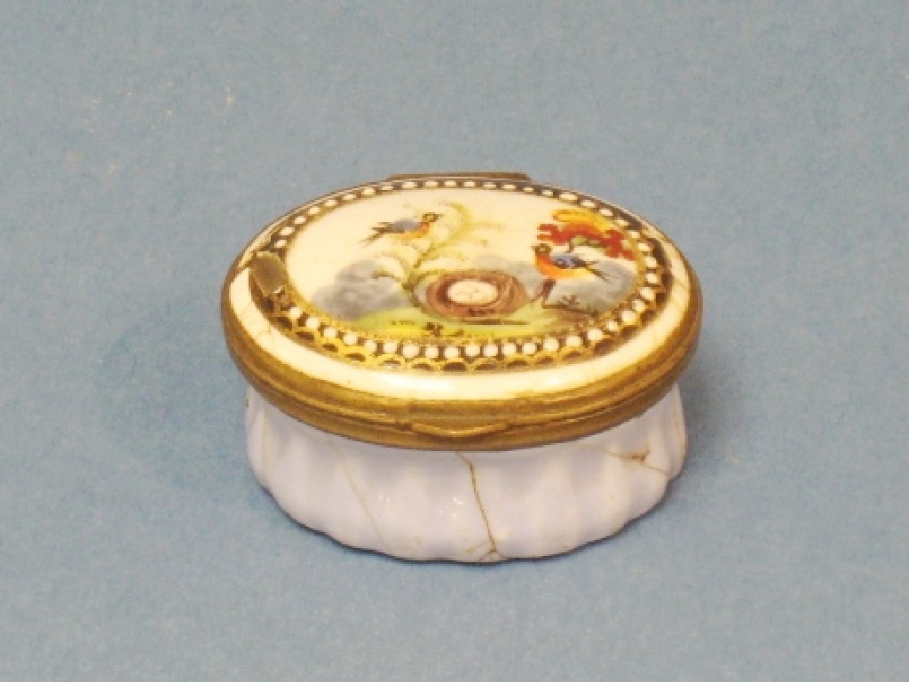 Appraisal: A small Bilston enamel oval Patch Box decorated birds and