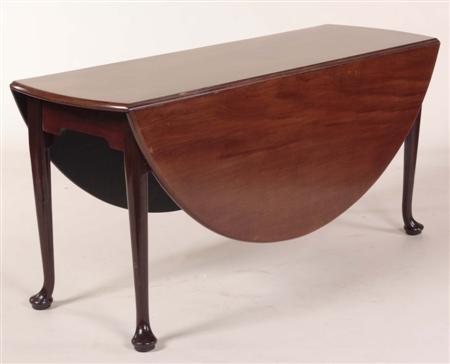 Appraisal: A George II style mahogany drop-flap table the circular top