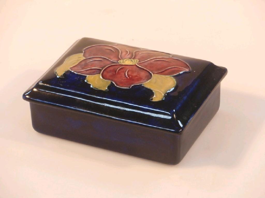 Appraisal: A Moorcroft rectangular box and cover with flower head decoration