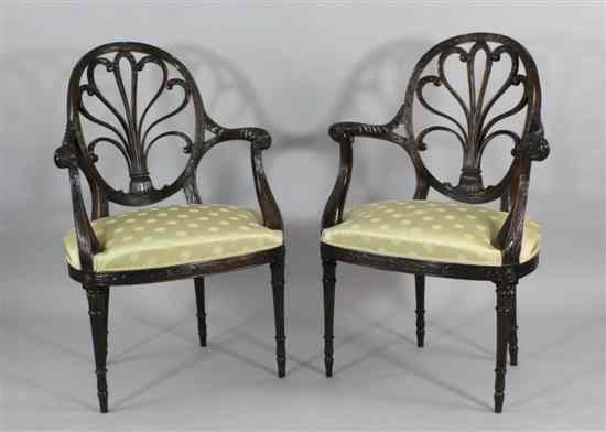 Appraisal: A pair of Hepplewhite style mahogany elbow chairs with anthemion