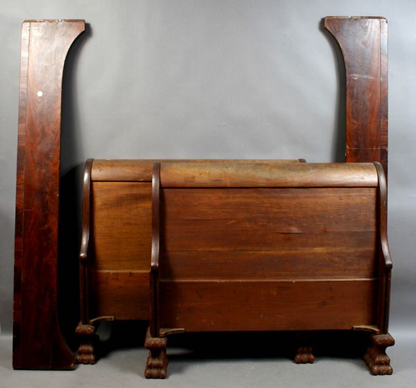 Appraisal: th Century mahogany sleigh bed with carved paw feet h