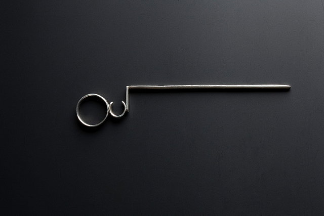 Appraisal: A LARDING NEEDLE c with ring handle and a channelled