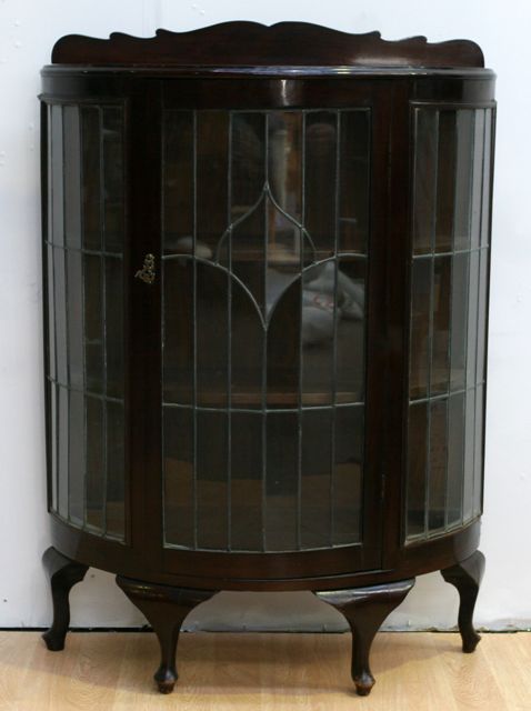 Appraisal: A 's mahogany and lead light demi lune display cabinet