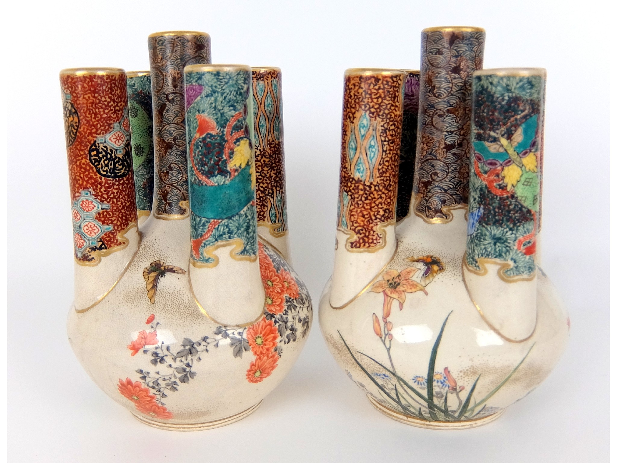 Appraisal: A pair of Japanese Satsuma multi-stem flower holderspainted with butterflies