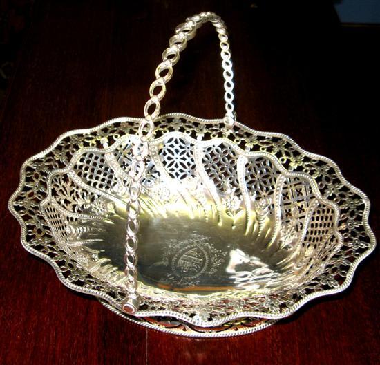 Appraisal: William IV swing handle cake basket with pierced decoration embossed