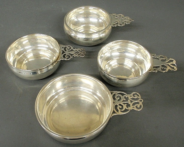 Appraisal: - Four sterling silver porringers with pierced tab handles largest