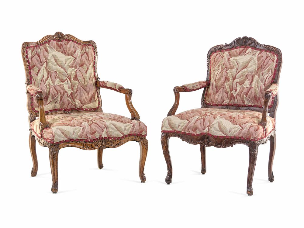 Appraisal: A Pair of Louis XV Walnut Fauteuils A Pair of