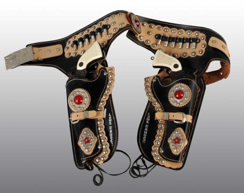 Appraisal: Lone Ranger Toy Double Holster Gun Set Description 's Set