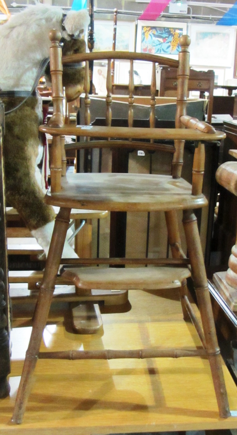 Appraisal: A th century beech child's stick back high chair and