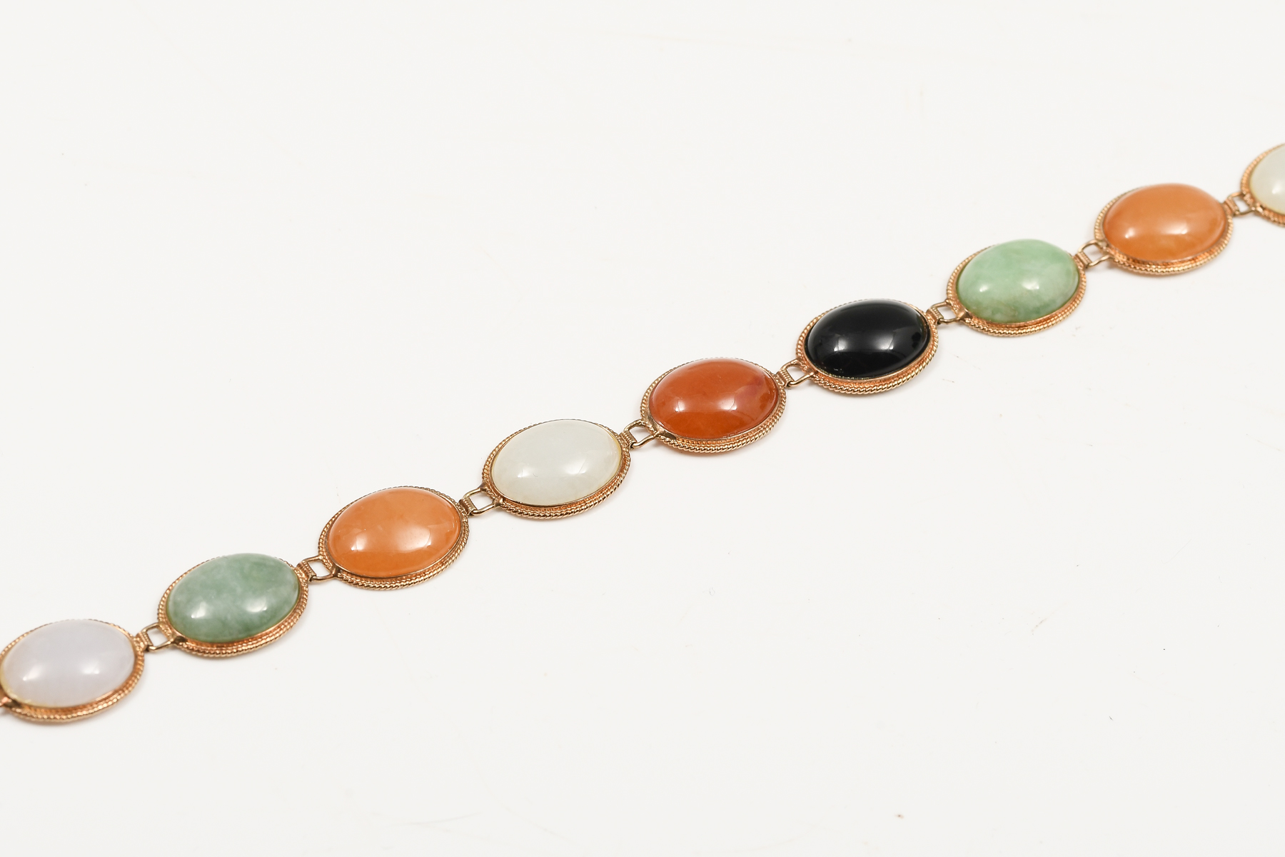 Appraisal: K JADE BRACELET K yellow gold bracelet with serpentine jade