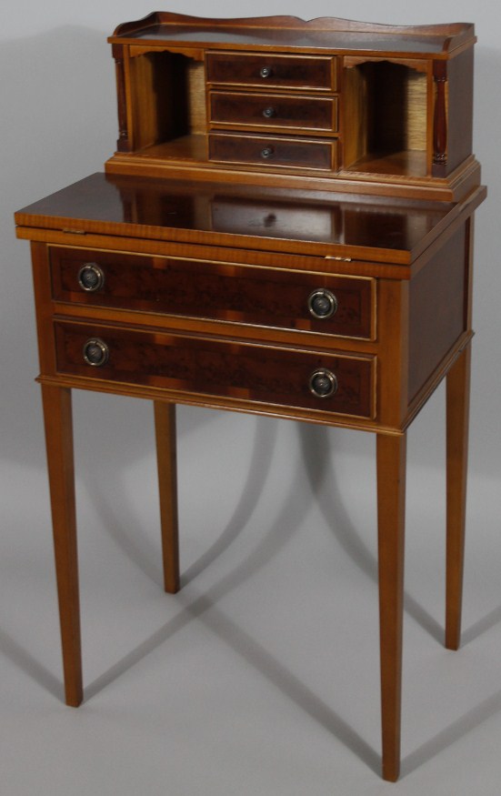 Appraisal: A Victorian style bird's eye finish writing desk surmounted by