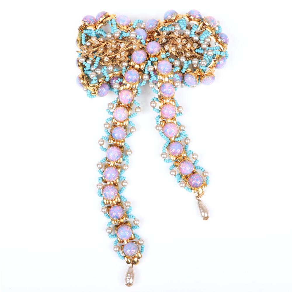 Appraisal: WILLIAM DE LILLO HUGE DANGLING BOW BROOCH WITH FAUX OPAL