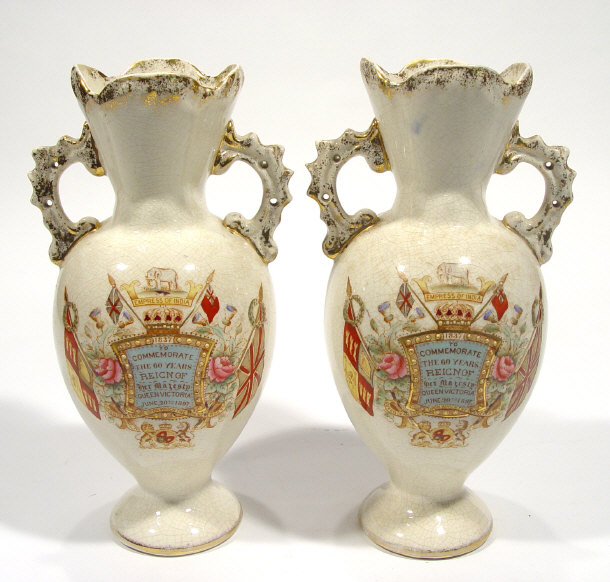 Appraisal: Pair of Victorian commemorative pottery vases with hand coloured and