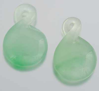 Appraisal: A Pair of Carved Jadeite Pendants Carved in round form