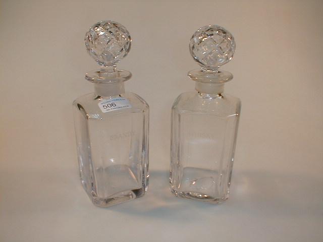 Appraisal: A pair of heavy crystal square decanters engraved whisky and