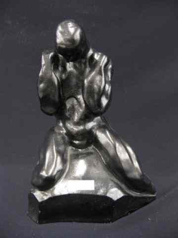 Appraisal: Deco Style Pottery Figurine of a Seated Nude Man stylized