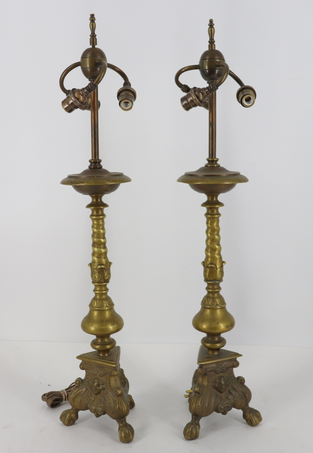 Appraisal: A PAIR OF ANTIQUE BRASS LAMPS Good heavy and quality