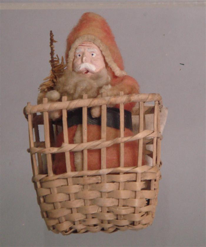 Appraisal: Paper mache Santa in basket red felt jacket small tree