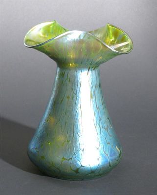 Appraisal: A Loetz iridescent glass vase with pinched trefoil rim covered