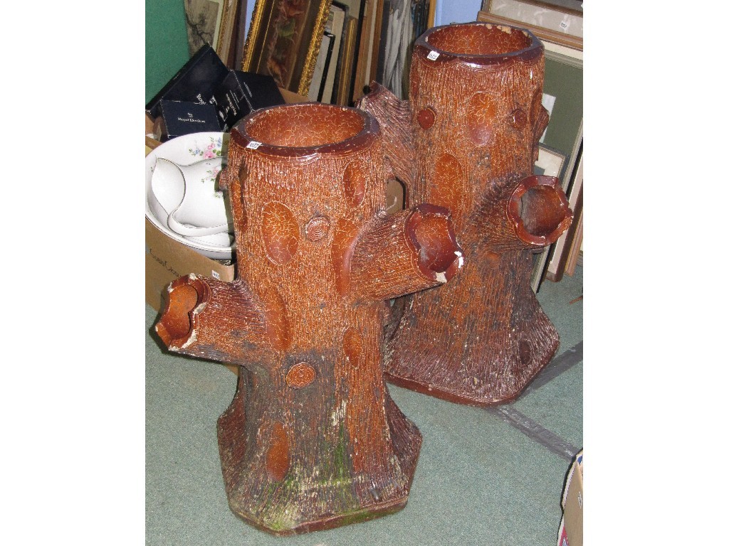 Appraisal: Pair of garden glazed stoneware planters modelled as tree trunks