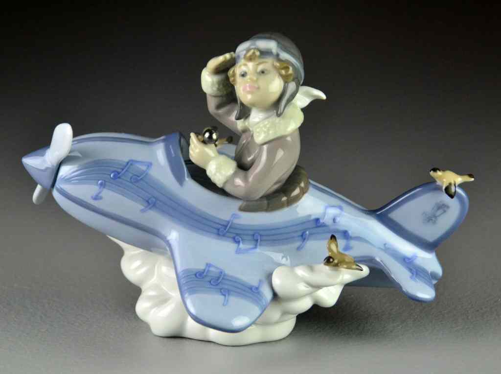 Appraisal: Lladro Porcelain Figurine ''Over the Clouds''''Mi Primer Vuelo'' depicting a