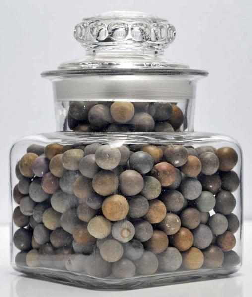 Appraisal: Jar of Limestone Marbles Description Limestone marbles are one of