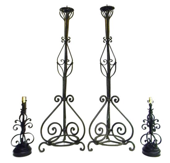 Appraisal: Cast iron lighting pair of torchieres and similar pair of