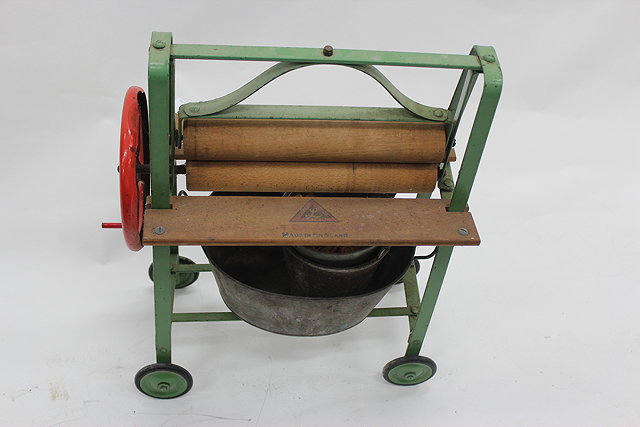 Appraisal: AN OLD TRI-ANG GREEN PAINTED TOY MANGLE complete with galvanised