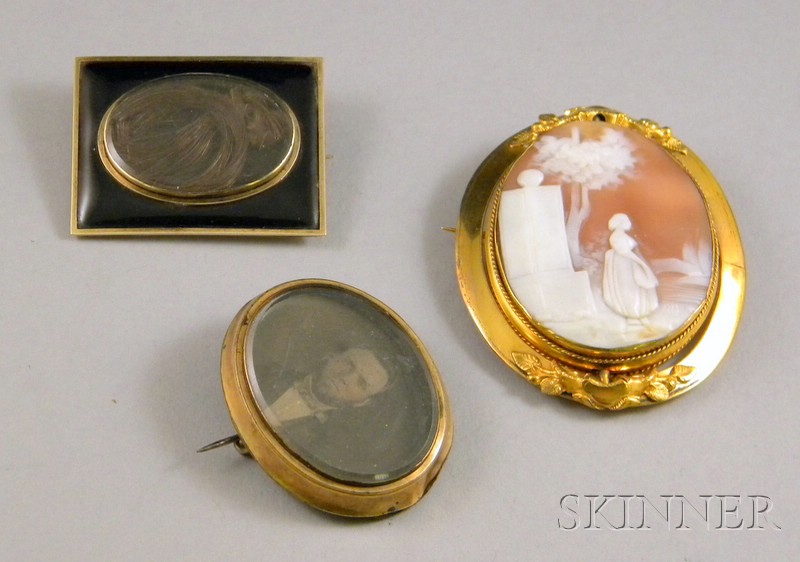 Appraisal: Three Victorian Mourning Brooches one a shell-carved cameo