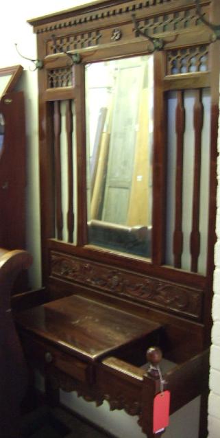 Appraisal: An Edwardian mahogany hall stand the dentil cornice over a