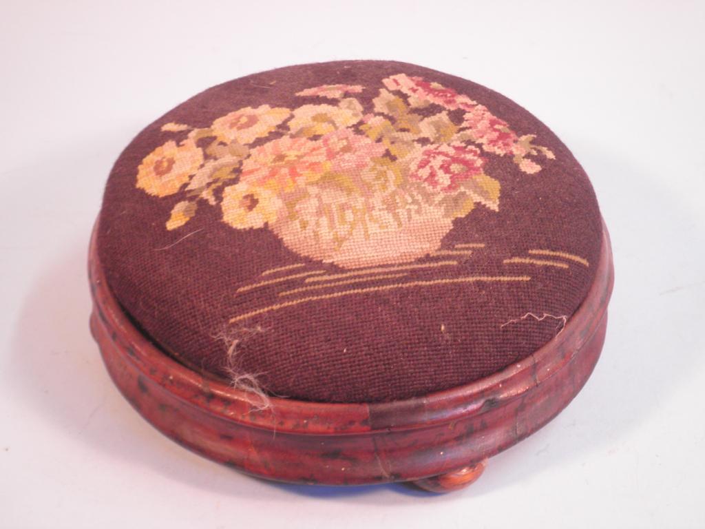 Appraisal: A late Victorian mahogany foot stool the embroidered woolwork cover