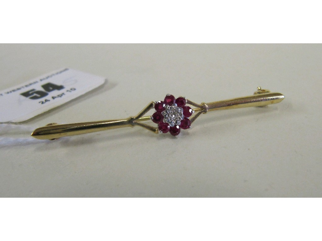 Appraisal: Nine carat gold bar brooch with ruby and diamond cluster