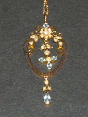 Appraisal: AN EDWARDIAN BLUE TOPAZ AND SEED PEARL PENDANT the ct