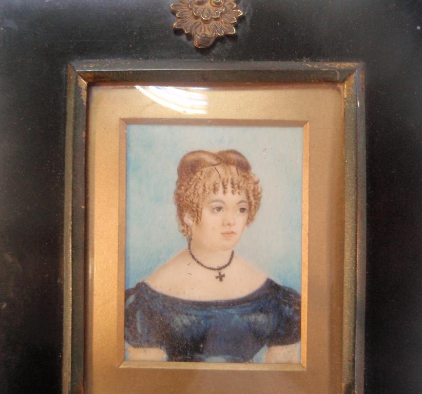 Appraisal: thC School A portrait miniature of a young lady half