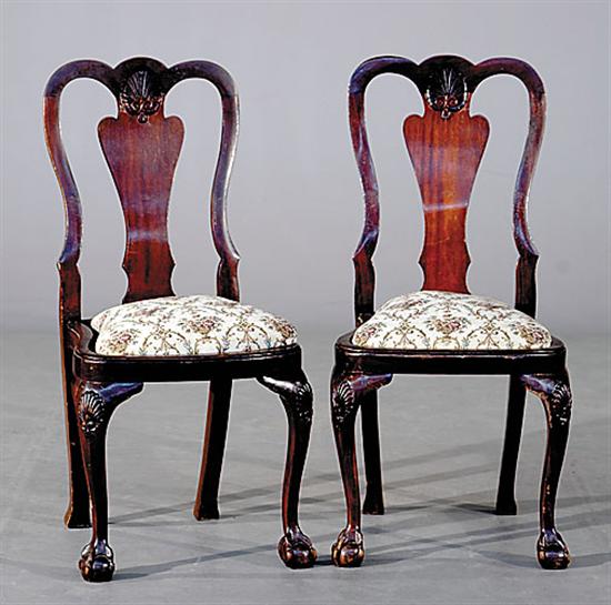 Appraisal: Pair English carved mahogany side chairs late th centuryshaped crest