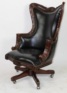 Appraisal: Carved mahogany swivel desk chair with leather Carved mahogany swivel