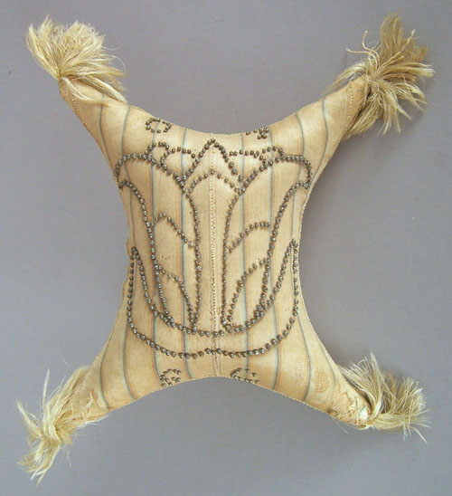 Appraisal: Pennsylvania pillow form silk covered pincushion with pin decoration in