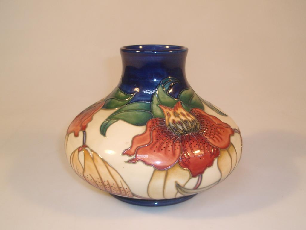 Appraisal: Moorcroft Modern a squat baluster vase decorated with Anna Lilies