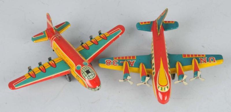 Appraisal: Lot of Tin Bomber Plane Friction Toys Description Japanese Working