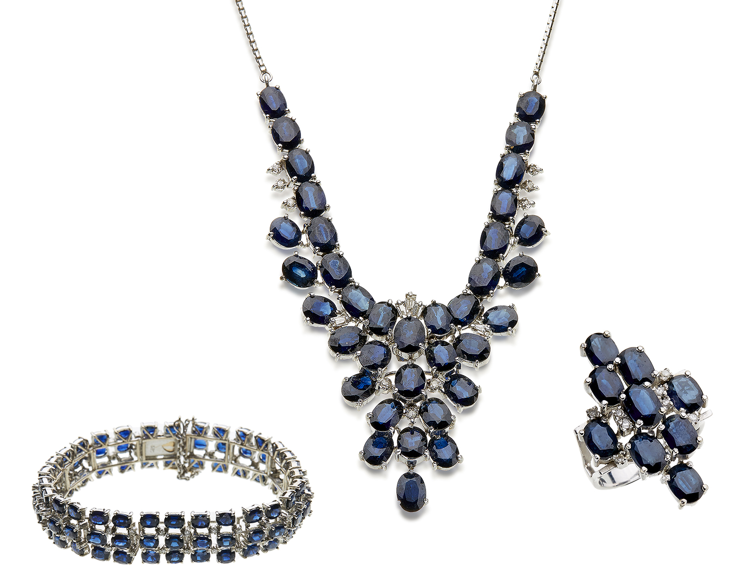 Appraisal: A SAPPHIRE JEWELLERY COCKTAIL SUITE Comprising a pendant necklace bracelet