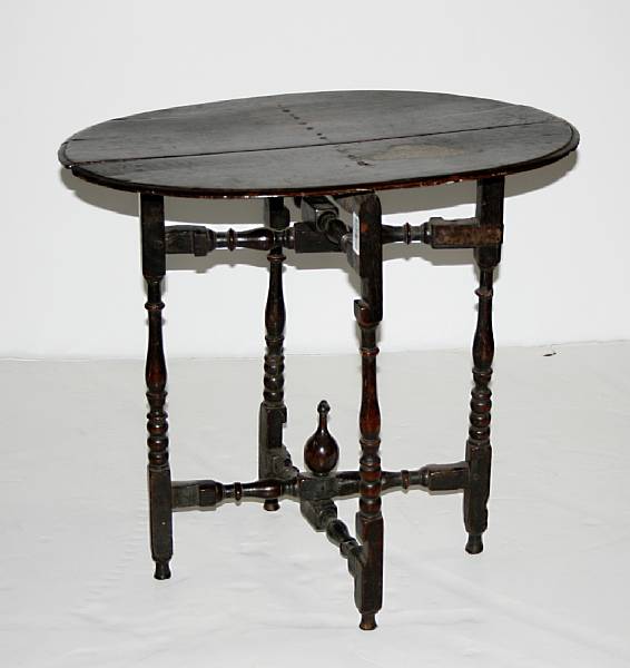 Appraisal: A Continental English oak hinged tuckaway table late th early