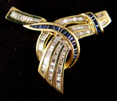 Appraisal: K YELLOW GOLD BROOCH OF BAGUETTE CUT SAPPHIRES DIAMONDS tapered