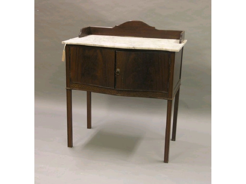 Appraisal: An Edwardian mahogany wash stand white marble top above a