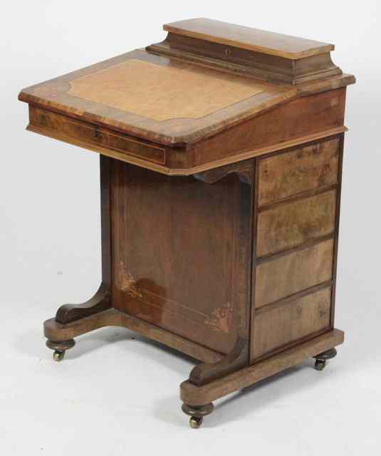 Appraisal: A Victorian figured walnut Davenport with later inset leather panel