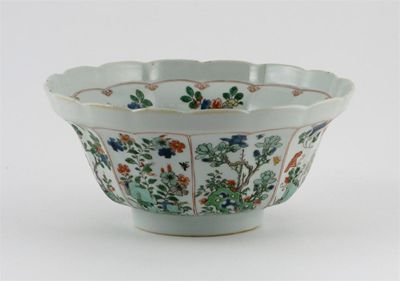 Appraisal: A Chinese famille verte moulded bowl painted with panels containing