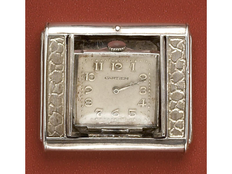 Appraisal: CARTIER POP-UP CLOCK Silver hand engraved manual wind clock in